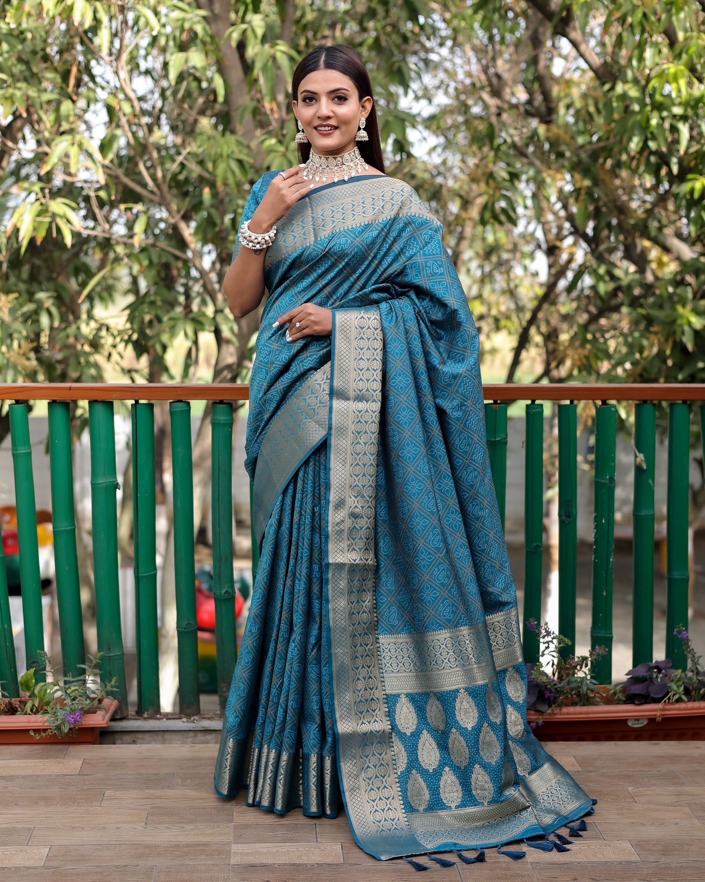 Embellished Silk Bandhej Teal Blue Color Patola Sarees