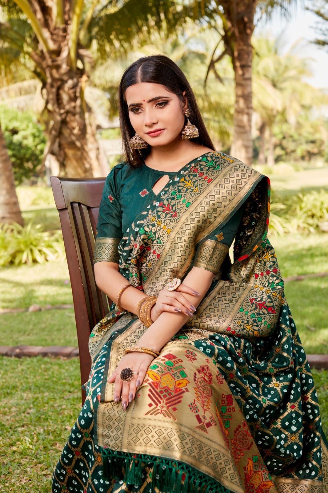 Delightful Green Color Gharchola Bandhej Silk Saree