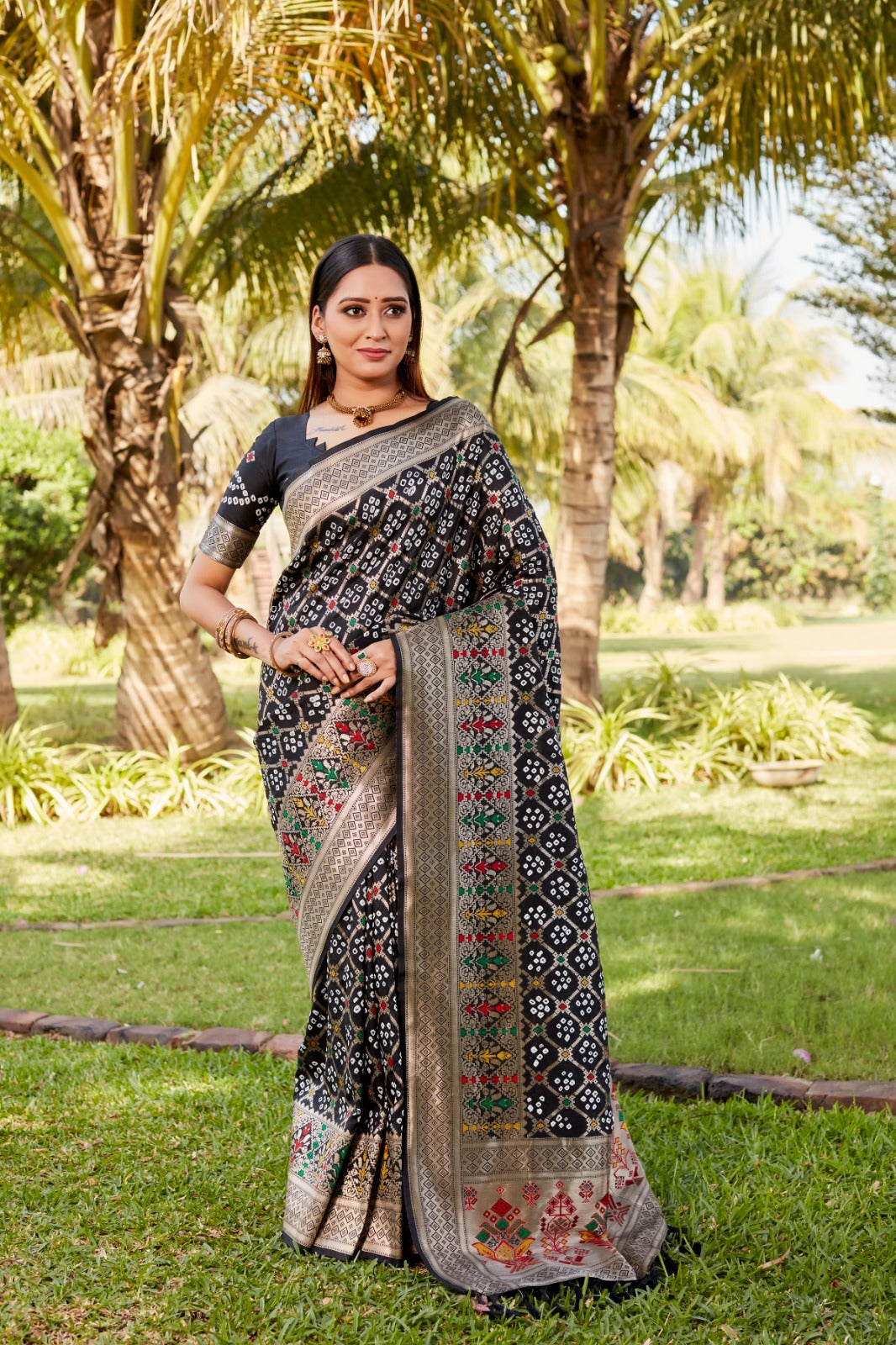 Delightful Black Color Gharchola Bandhej Silk Saree